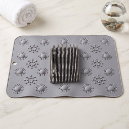 Alfombra exfoliante con esponja gris